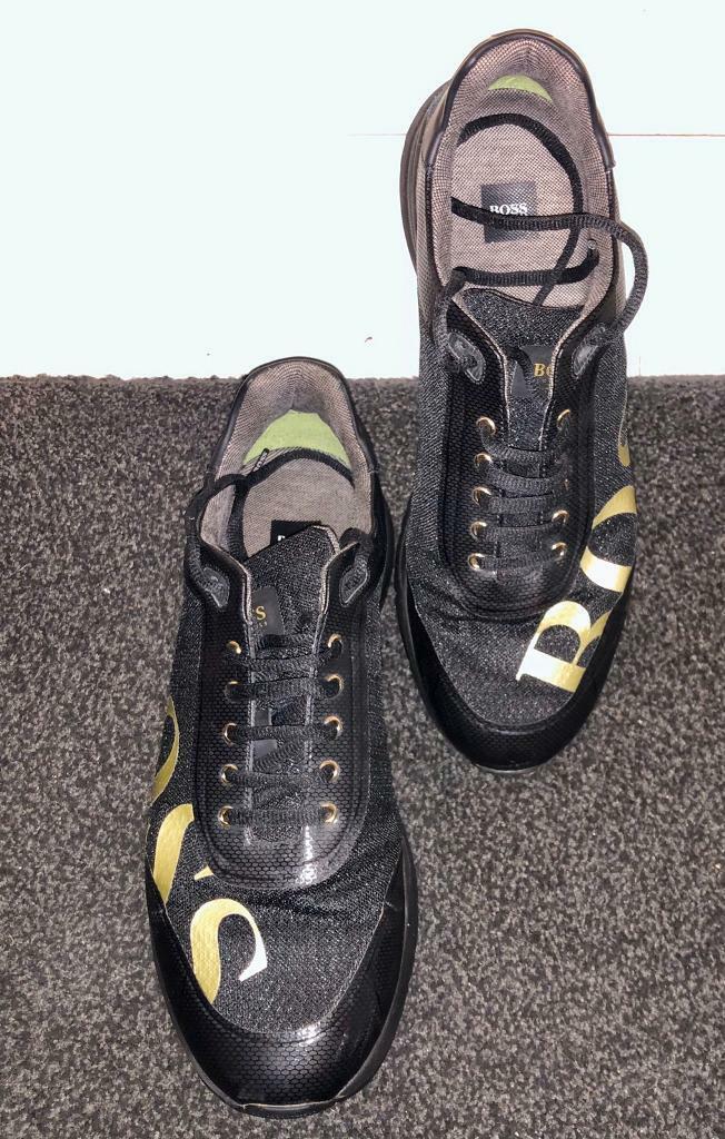 black and gold boss trainers